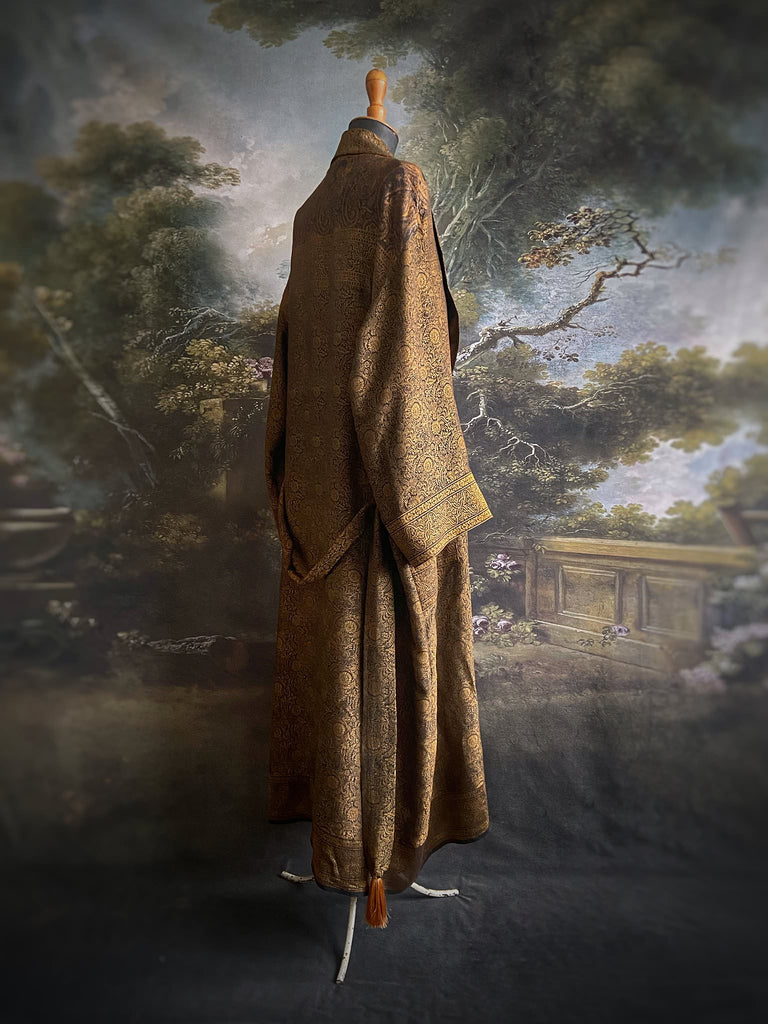 Gold and black silk brocade luxury dressing robe with printed silk lining and tassel sash. Bohemian style created from antique and vintage textiles by the Pavilion Parade studio.