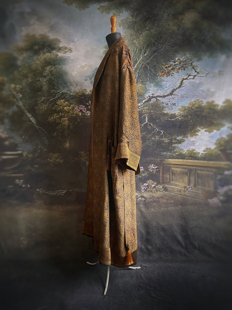 Gold and black silk brocade luxury dressing robe with printed silk lining and tassel sash. Bohemian style created from antique and vintage textiles by the Pavilion Parade studio.