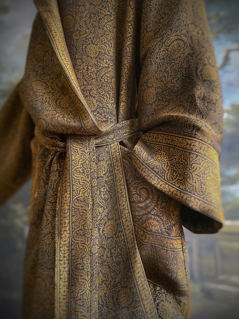 Gold and black silk brocade luxury dressing robe with printed silk lining and tassel sash. Bohemian style created from antique and vintage textiles by the Pavilion Parade studio.
