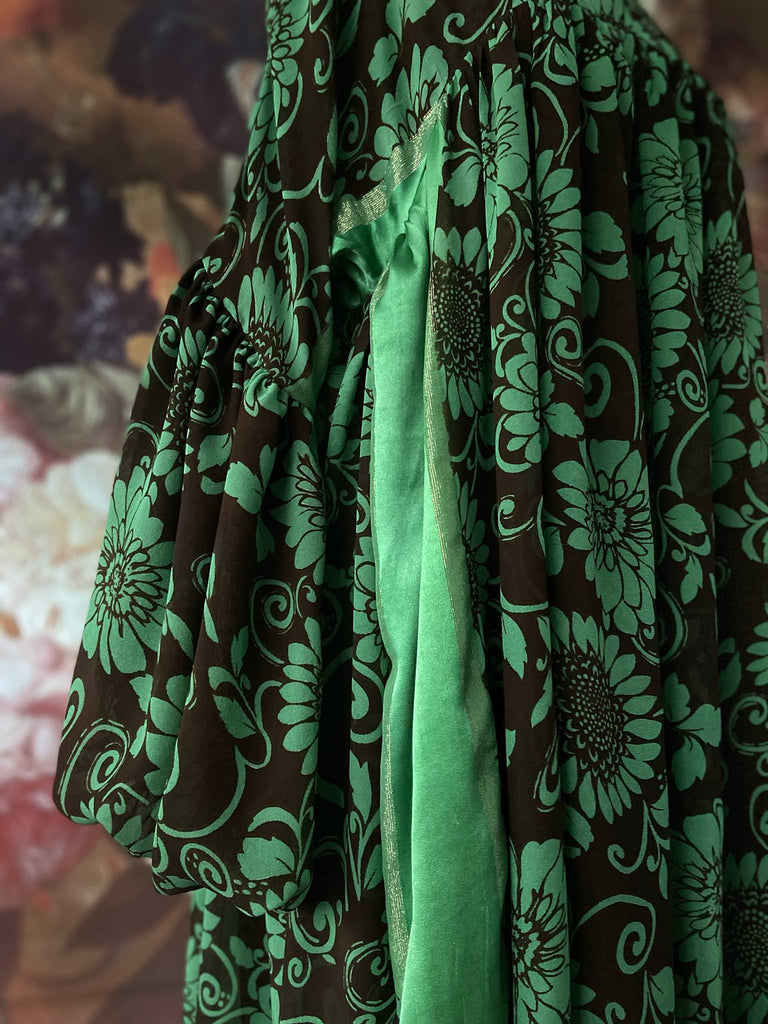 Jade green and chocolate silk georgette floral print maxi dress with full balloon sleeves and side pockets. Bohemian styles created from antique and vintage textiles by the Pavilion Parade studio.