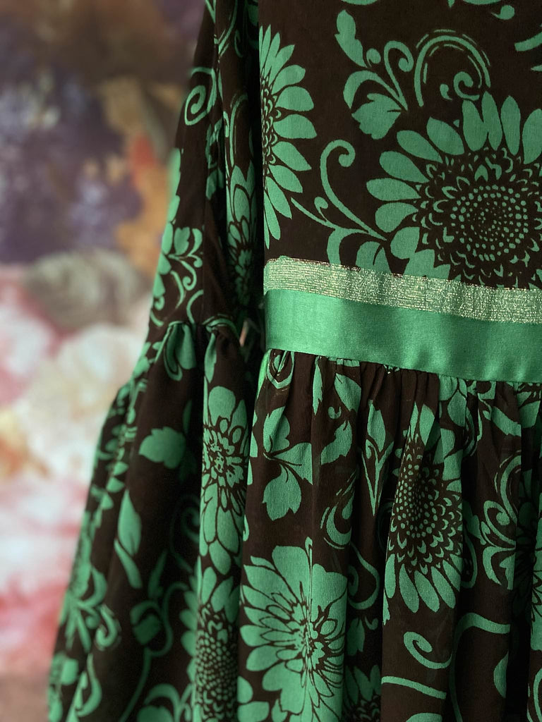 Jade green and chocolate silk georgette floral print maxi dress with full balloon sleeves and side pockets. Bohemian styles created from antique and vintage textiles by the Pavilion Parade studio.