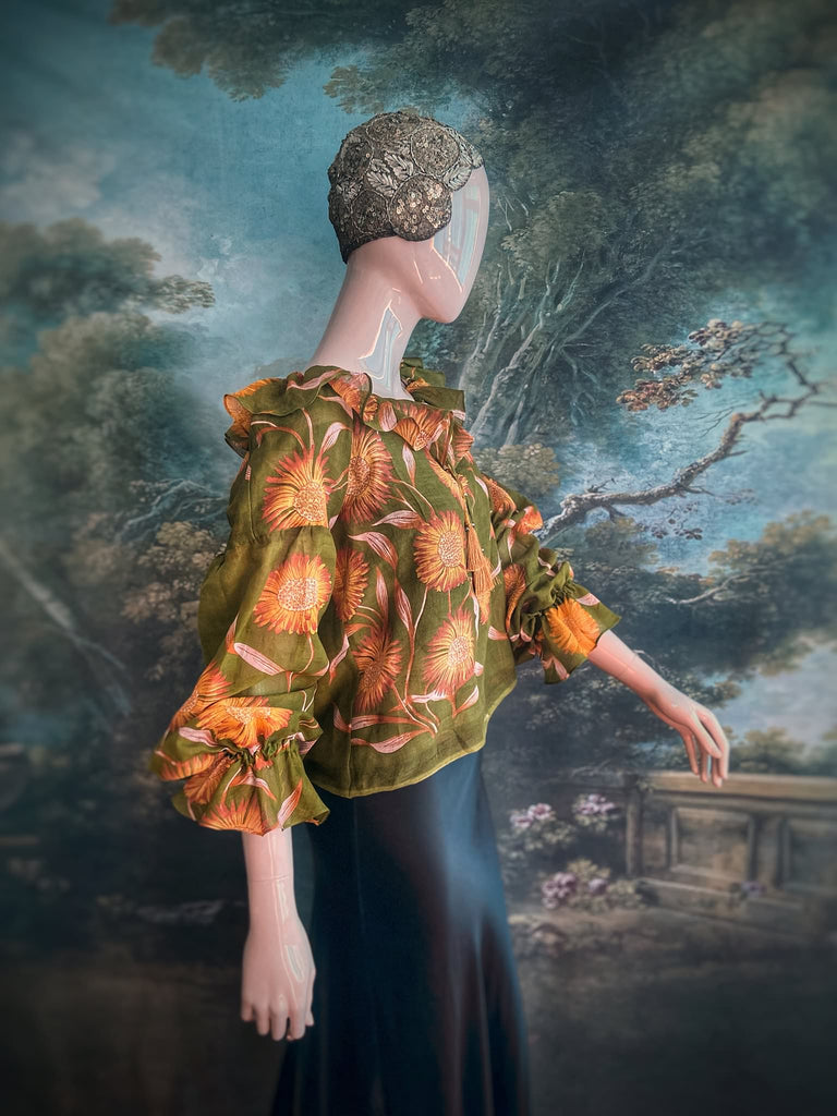 Acid green and sunflower yellow cotton muslin block printed blouse with long full sleeves and adjustable drawstring neckline. Bohemian styles sustainably created from antique and vintage textiles by the Pavilion Parade studio. 