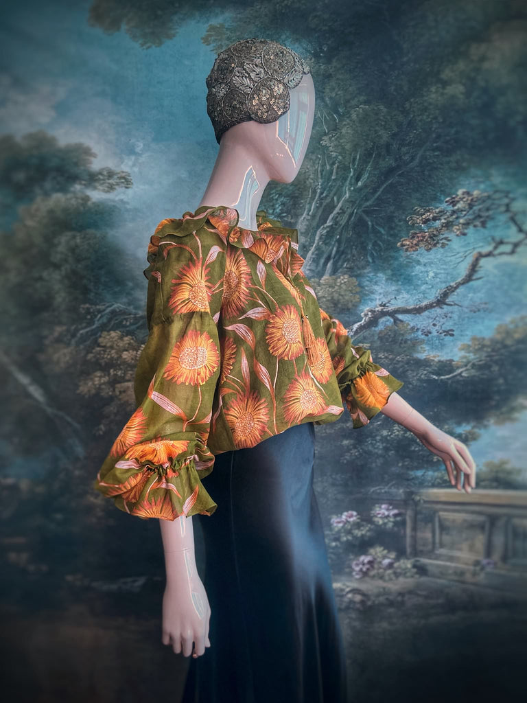 Acid green and sunflower yellow cotton muslin block printed blouse with long full sleeves and adjustable drawstring neckline. Bohemian styles sustainably created from antique and vintage textiles by the Pavilion Parade studio. 