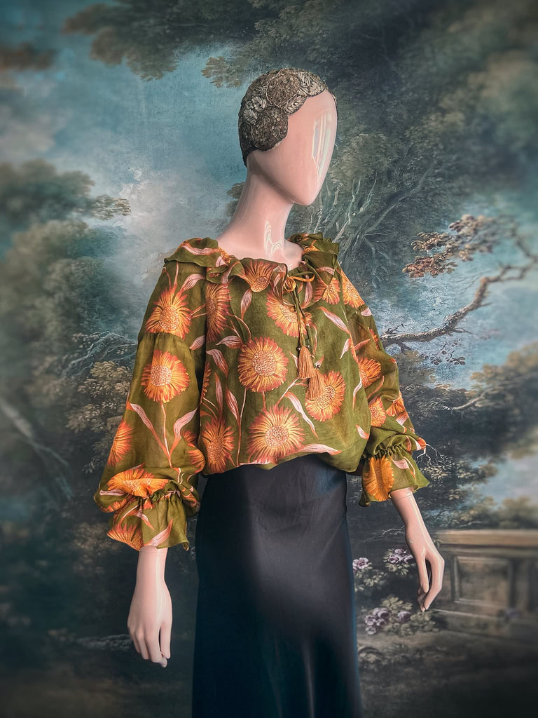 Acid green and sunflower yellow cotton muslin block printed blouse with long full sleeves and adjustable drawstring neckline. Bohemian styles sustainably created from antique and vintage textiles by the Pavilion Parade studio. 