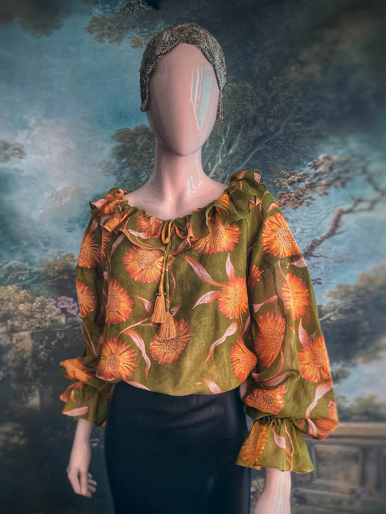 Acid green and sunflower yellow cotton muslin block printed blouse with long full sleeves and adjustable drawstring neckline. Bohemian styles sustainably created from antique and vintage textiles by the Pavilion Parade studio. 