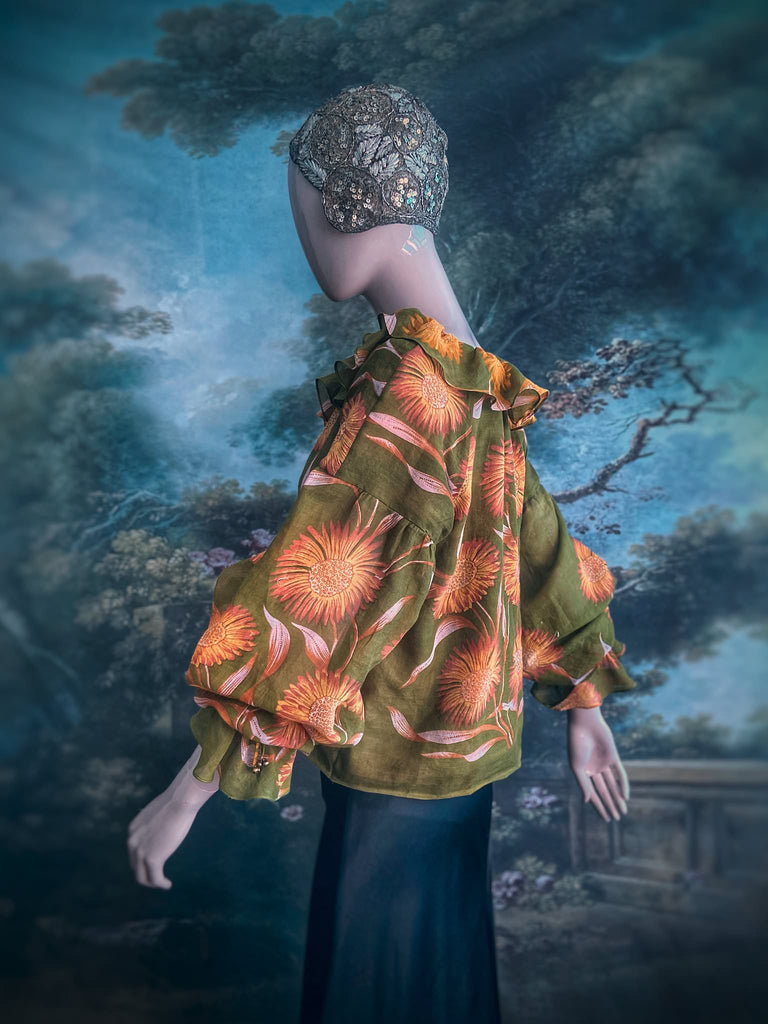 Acid green and sunflower yellow cotton muslin block printed blouse with long full sleeves and adjustable drawstring neckline. Bohemian styles sustainably created from antique and vintage textiles by the Pavilion Parade studio. 