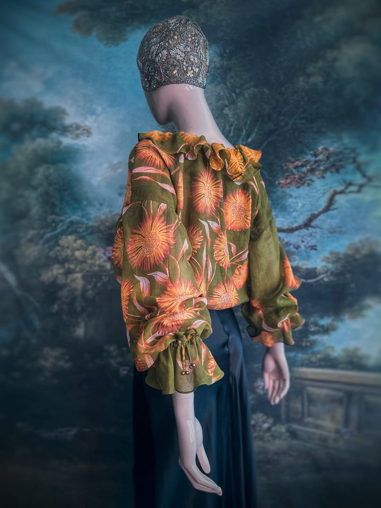 Acid green and sunflower yellow cotton muslin block printed blouse with long full sleeves and adjustable drawstring neckline. Bohemian styles sustainably created from antique and vintage textiles by the Pavilion Parade studio. 