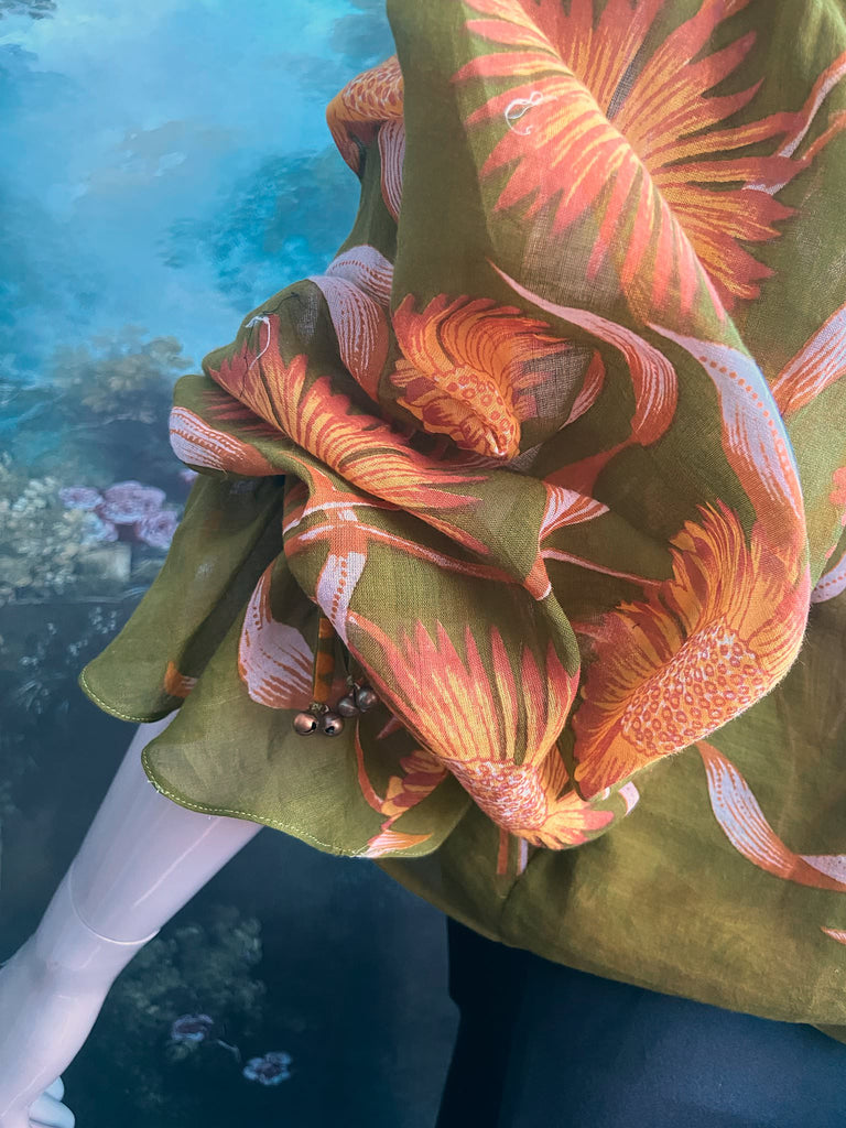 Acid green and sunflower yellow cotton muslin block printed blouse with long full sleeves and adjustable drawstring neckline. Bohemian styles sustainably created from antique and vintage textiles by the Pavilion Parade studio. 