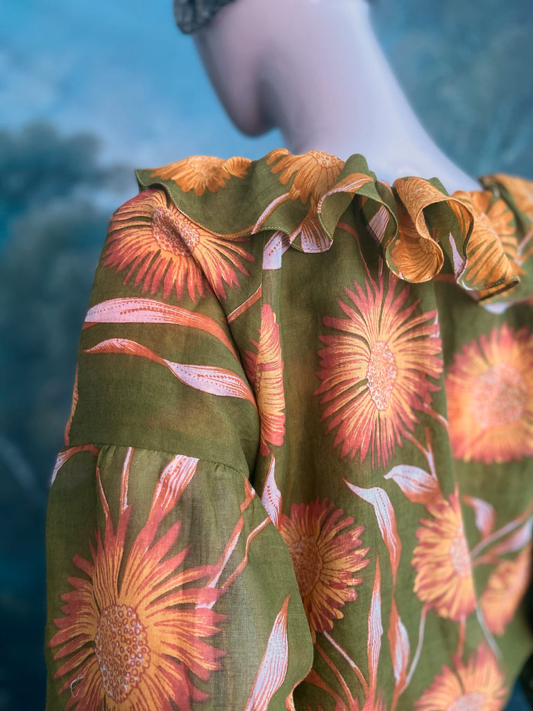 Acid green and sunflower yellow cotton muslin block printed blouse with long full sleeves and adjustable drawstring neckline. Bohemian styles sustainably created from antique and vintage textiles by the Pavilion Parade studio. 