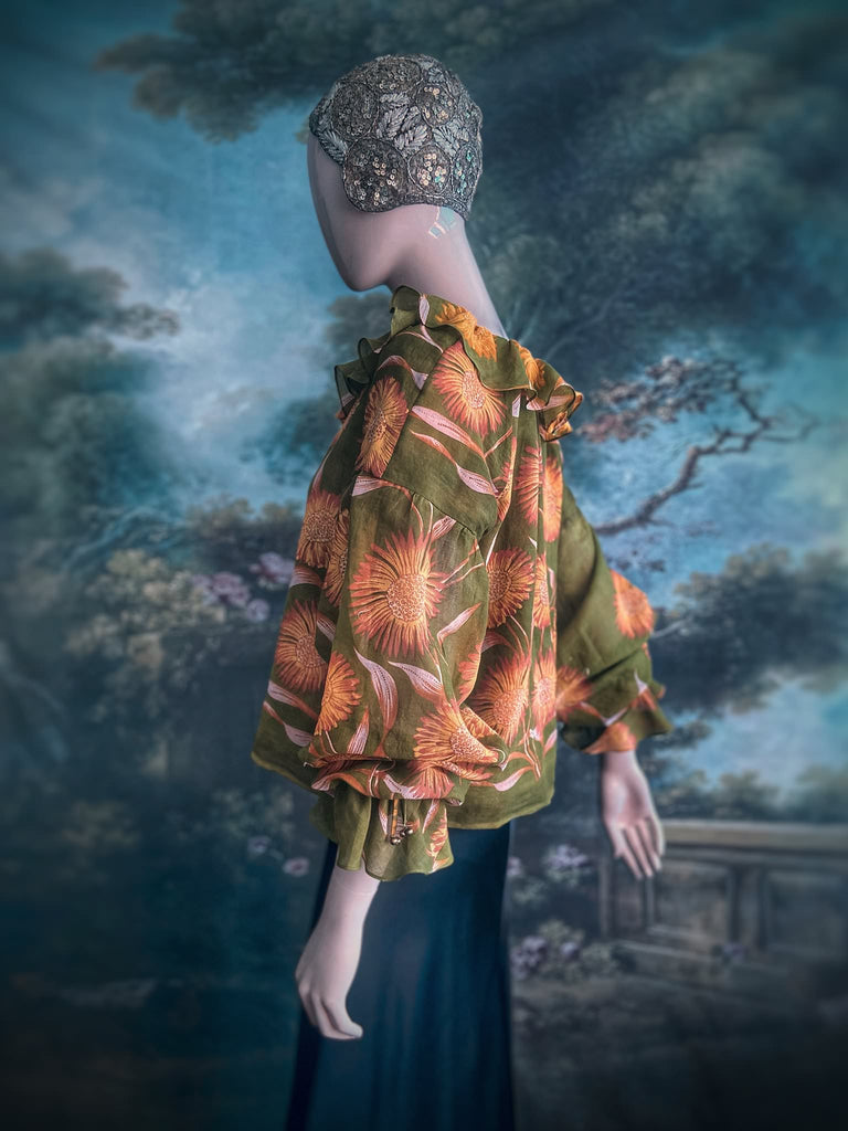 Acid green and sunflower yellow cotton muslin block printed blouse with long full sleeves and adjustable drawstring neckline. Bohemian styles sustainably created from antique and vintage textiles by the Pavilion Parade studio. 