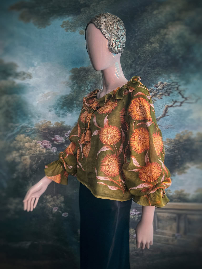 Acid green and sunflower yellow cotton muslin block printed blouse with long full sleeves and adjustable drawstring neckline. Bohemian styles sustainably created from antique and vintage textiles by the Pavilion Parade studio. 