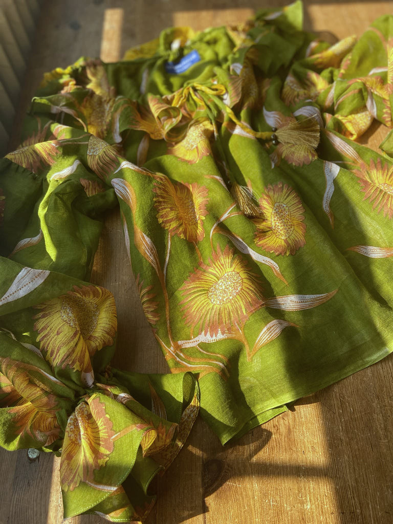Acid green and sunflower yellow cotton muslin block printed blouse with long full sleeves and adjustable drawstring neckline. Bohemian styles sustainably created from antique and vintage textiles by the Pavilion Parade studio. 