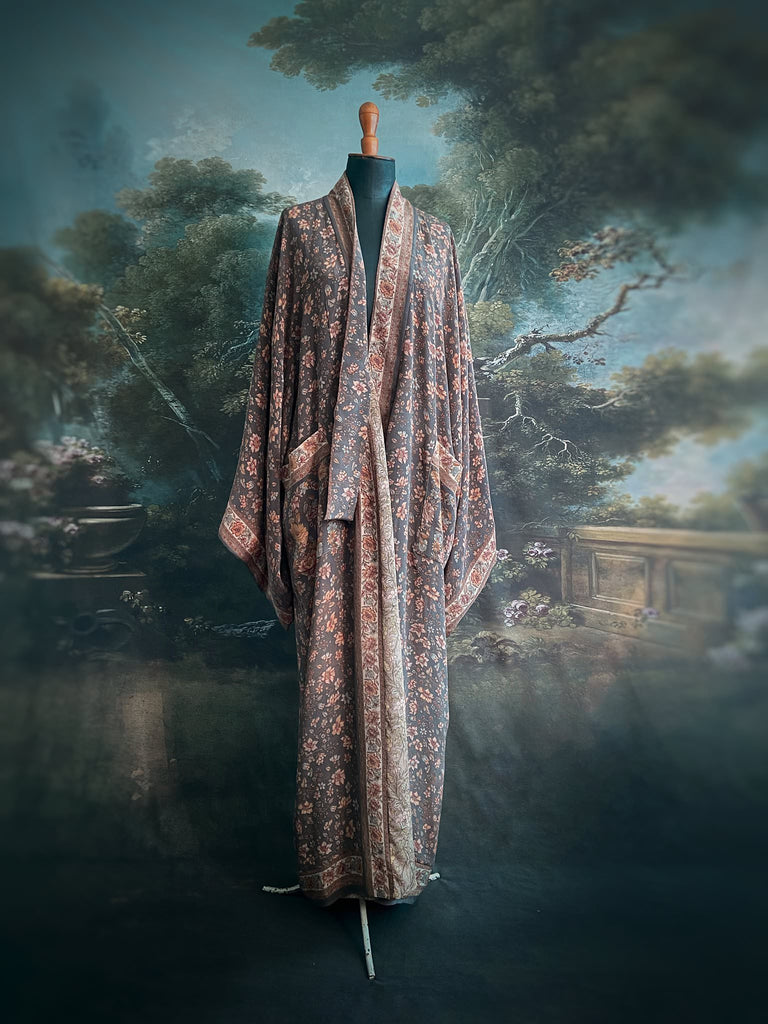 Full length 1920s inspired kimono robe with large patch pockets. Newly created from a grey, peach and apricot vintage silk crepe. Fully lined in silk with French seams throughout. Bohemian styles sustainably created from antique and vintage textiles by the Pavilion Parade studio.