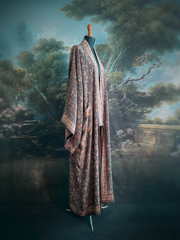 Full length 1920s inspired kimono robe with large patch pockets. Newly created from a grey, peach and apricot vintage silk crepe. Fully lined in silk with French seams throughout. Bohemian styles sustainably created from antique and vintage textiles by the Pavilion Parade studio.
