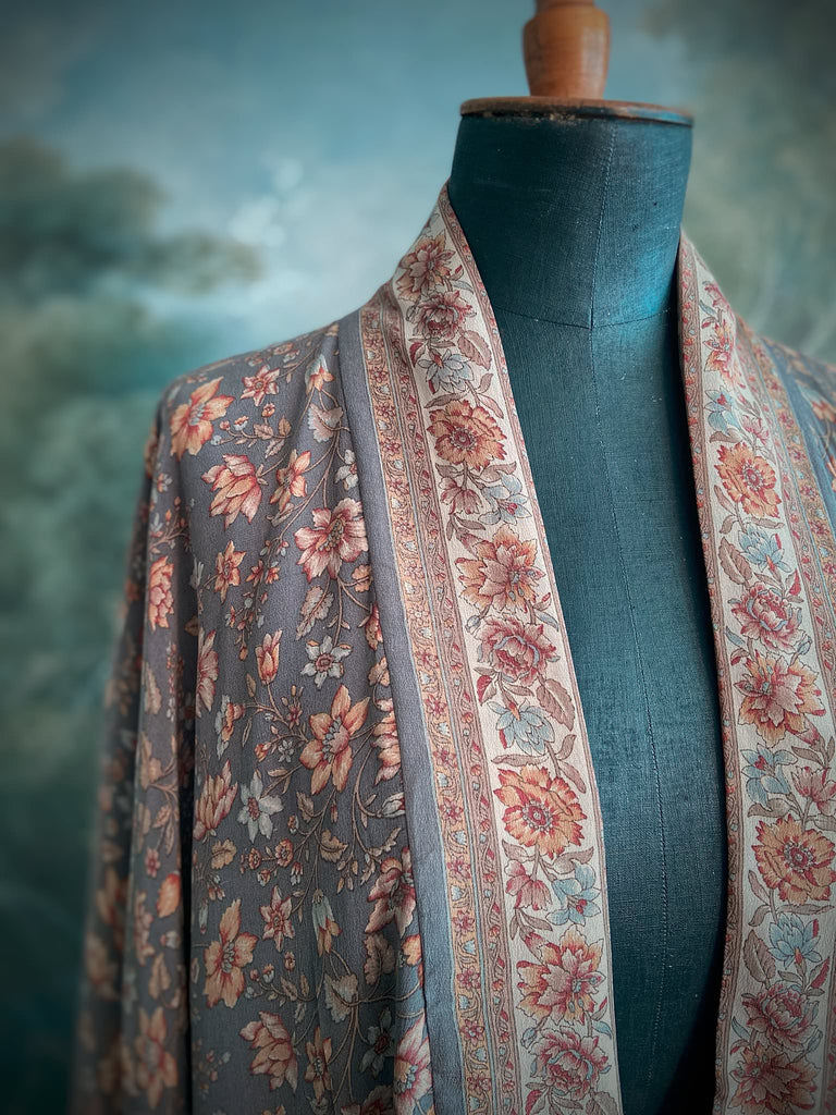 Full length 1920s inspired kimono robe with large patch pockets. Newly created from a grey, peach and apricot vintage silk crepe. Fully lined in silk with French seams throughout. Bohemian styles sustainably created from antique and vintage textiles by the Pavilion Parade studio.