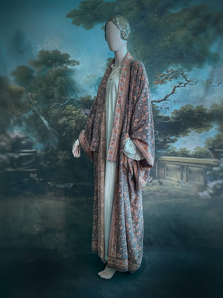 Full length 1920s inspired kimono robe with large patch pockets. Newly created from a grey, peach and apricot vintage silk crepe. Fully lined in silk with French seams throughout. Bohemian styles sustainably created from antique and vintage textiles by the Pavilion Parade studio.