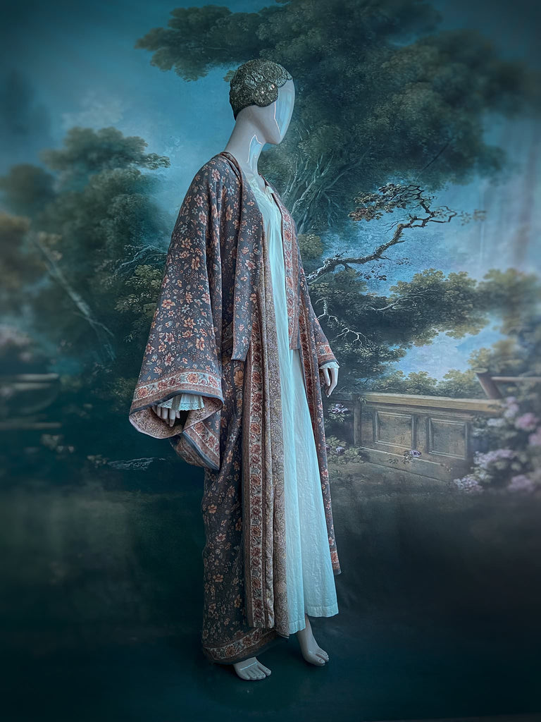 Full length 1920s inspired kimono robe with large patch pockets. Newly created from a grey, peach and apricot vintage silk crepe. Fully lined in silk with French seams throughout. Bohemian styles sustainably created from antique and vintage textiles by the Pavilion Parade studio.