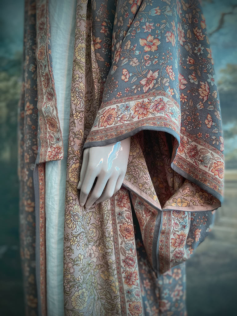 Full length 1920s inspired kimono robe with large patch pockets. Newly created from a grey, peach and apricot vintage silk crepe. Fully lined in silk with French seams throughout. Bohemian styles sustainably created from antique and vintage textiles by the Pavilion Parade studio.