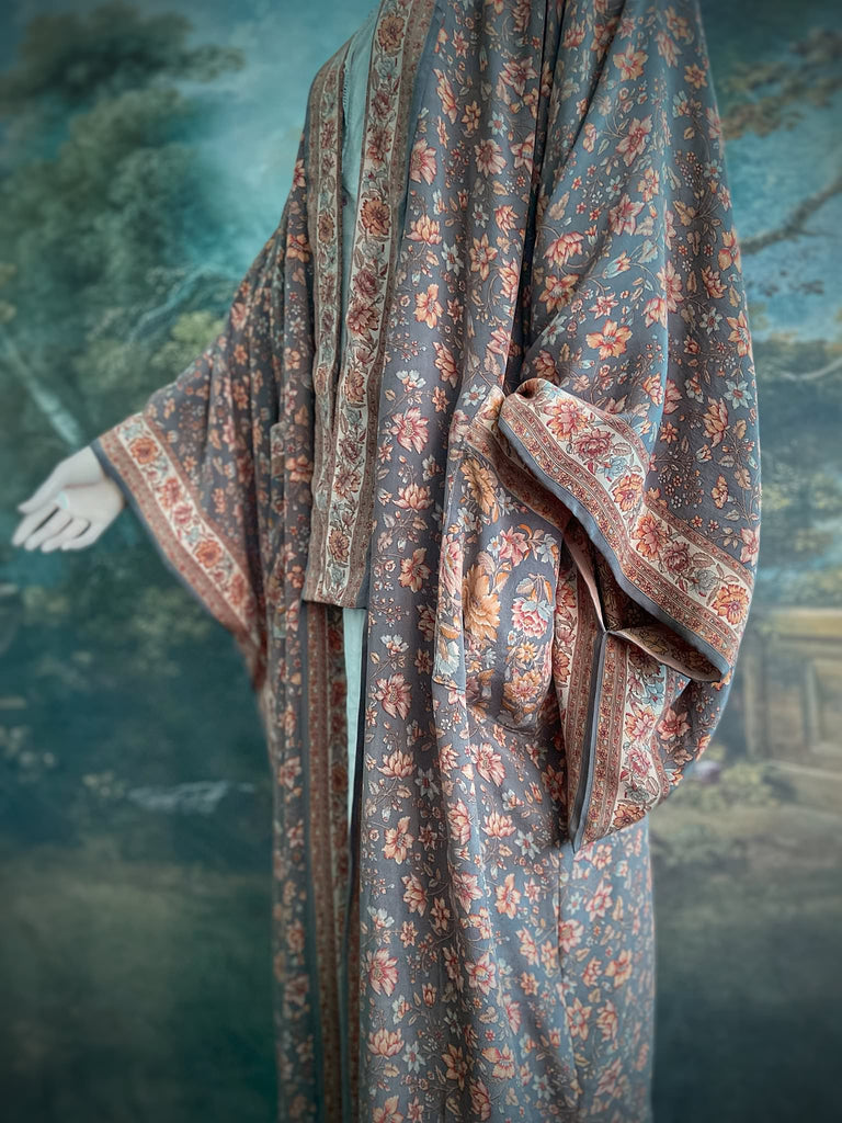 Full length 1920s inspired kimono robe with large patch pockets. Newly created from a grey, peach and apricot vintage silk crepe. Fully lined in silk with French seams throughout. Bohemian styles sustainably created from antique and vintage textiles by the Pavilion Parade studio.