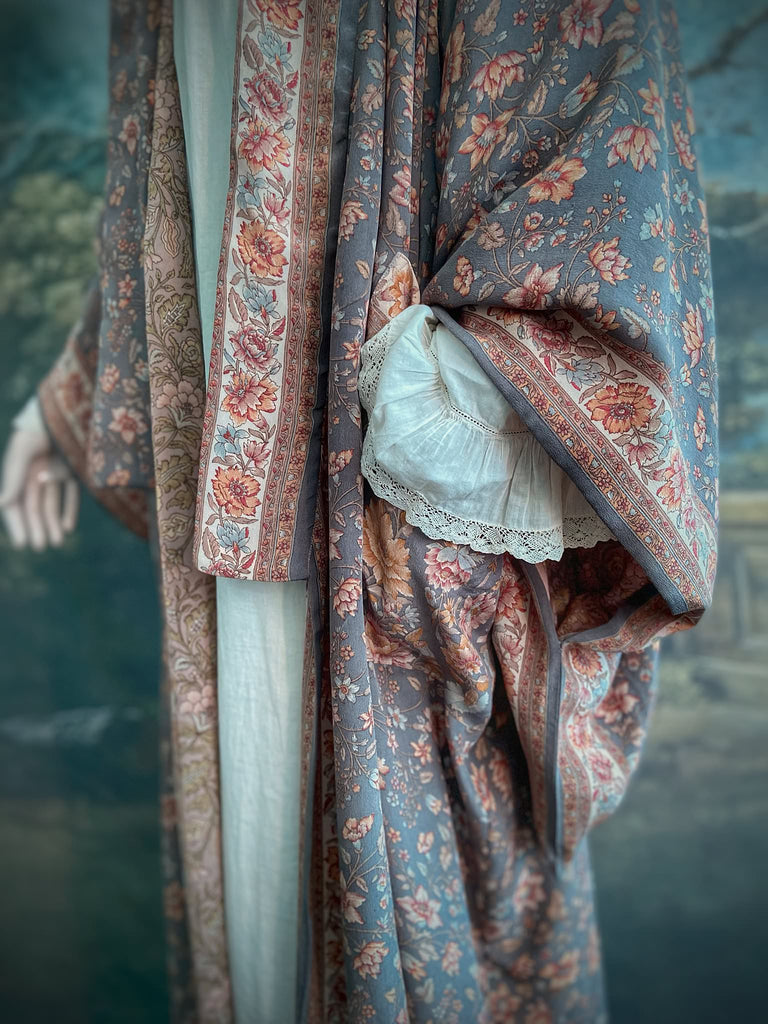 Full length 1920s inspired kimono robe with large patch pockets. Newly created from a grey, peach and apricot vintage silk crepe. Fully lined in silk with French seams throughout. Bohemian styles sustainably created from antique and vintage textiles by the Pavilion Parade studio.