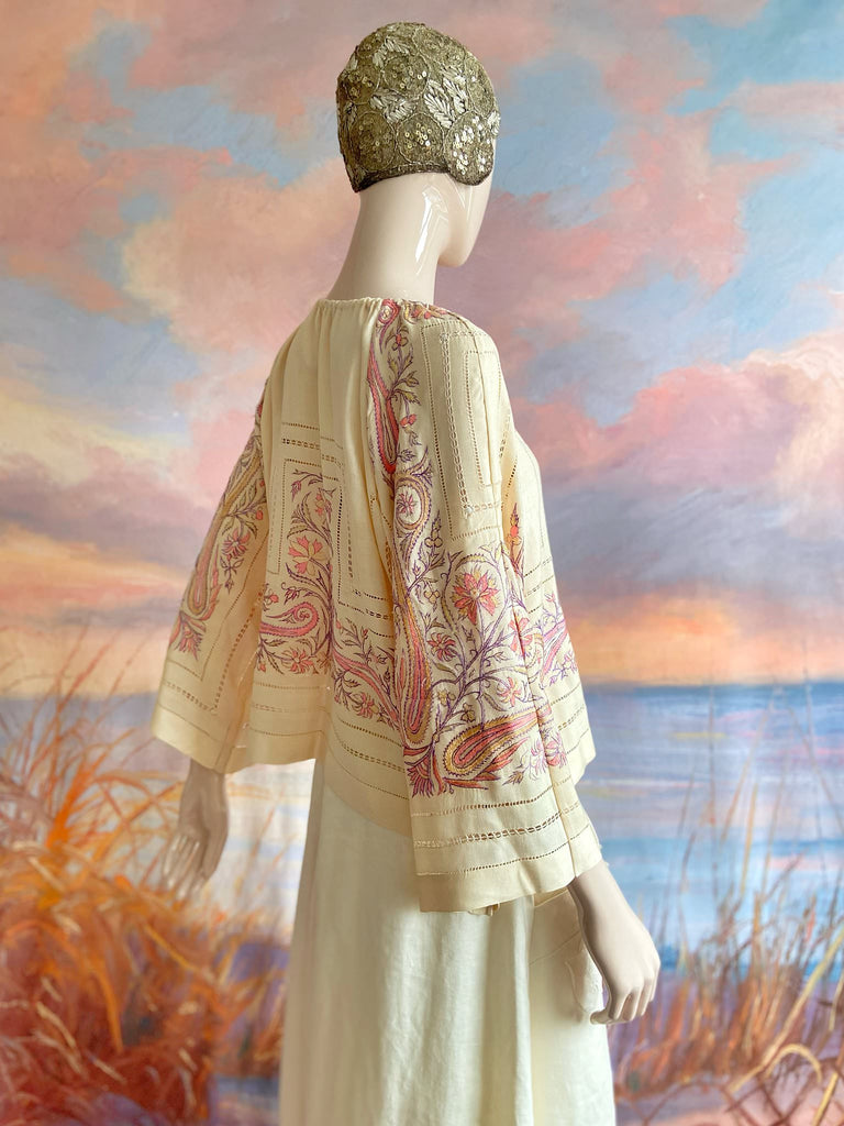 Hand embroidered cream silk blouse with coral and lavender Indian scrolling floral motifs and drawn thread work. A unique piece created from antique textiles by Pavilion Parade