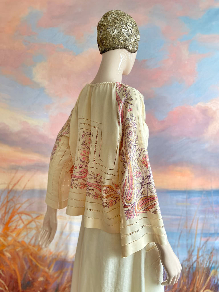 Hand embroidered cream silk blouse with coral and lavender Indian scrolling floral motifs and drawn thread work. A unique piece created from antique textiles by Pavilion Parade