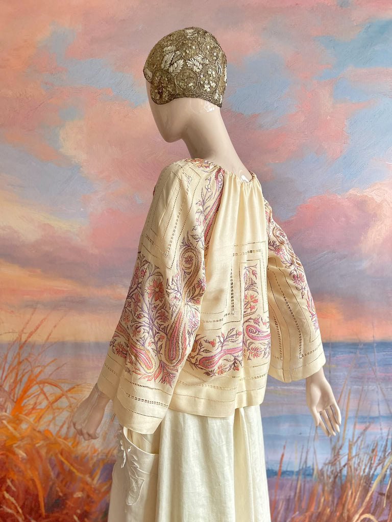 Hand embroidered cream silk blouse with coral and lavender Indian scrolling floral motifs and drawn thread work. A unique piece created from antique textiles by Pavilion Parade