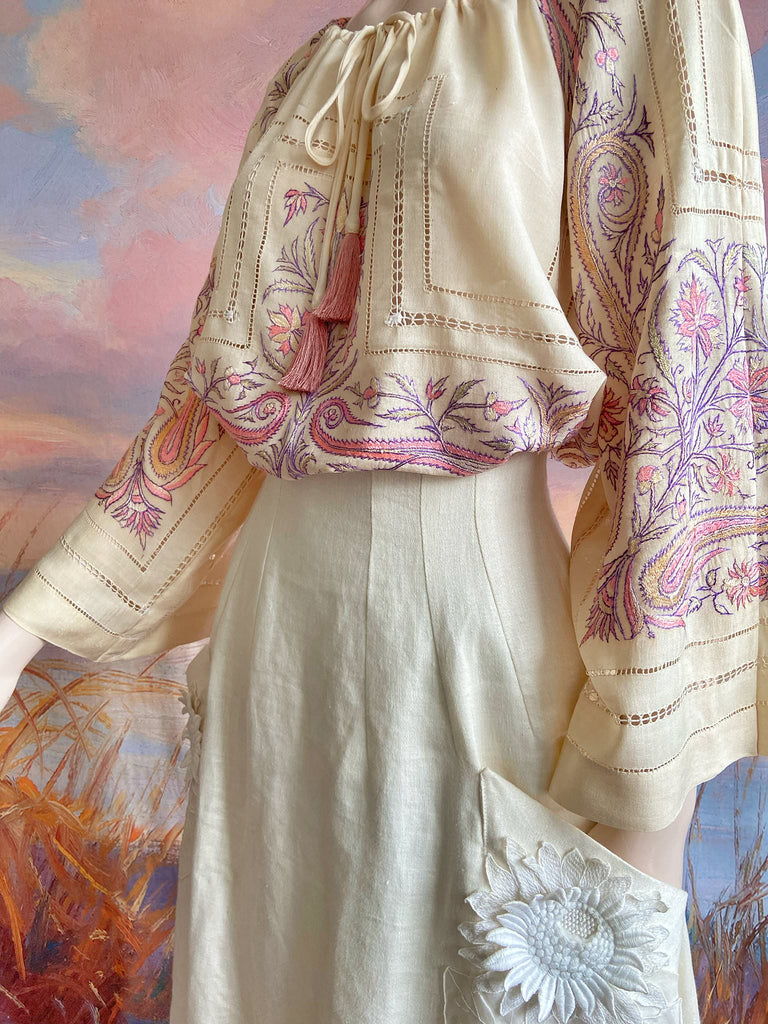 Hand embroidered cream silk blouse with coral and lavender Indian scrolling floral motifs and drawn thread work. A unique piece created from antique textiles by Pavilion Parade