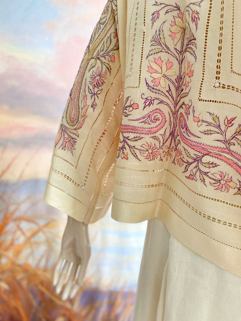 Hand embroidered cream silk blouse with coral and lavender Indian scrolling floral motifs and drawn thread work. A unique piece created from antique textiles by Pavilion Parade