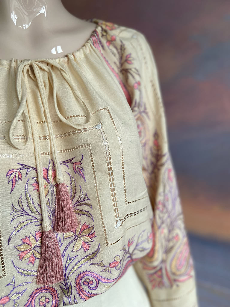Hand embroidered cream silk blouse with coral and lavender Indian scrolling floral motifs and drawn thread work. A unique piece created from antique textiles by Pavilion Parade