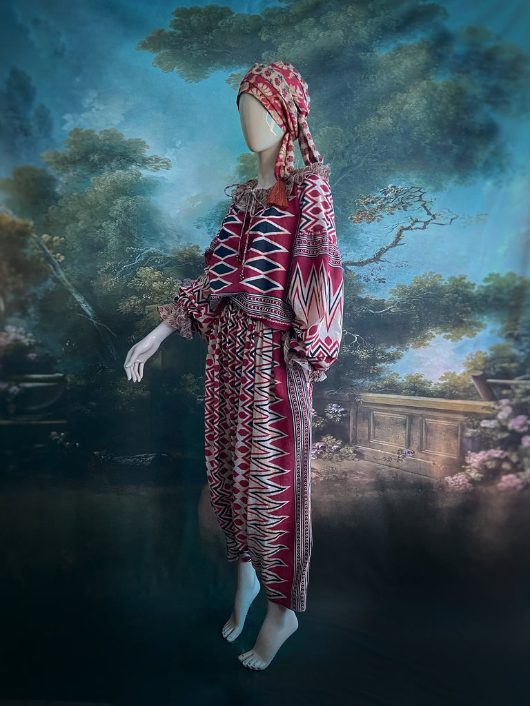 Red, black and ivory fine cotton Harlequin Corsair inspired beach pyjamas with full sleeved frill collar blouse and drawstring Ottoman harem pants. Bohemian styles created from  vintage and antique textiles by the Pavilion Parade studio
