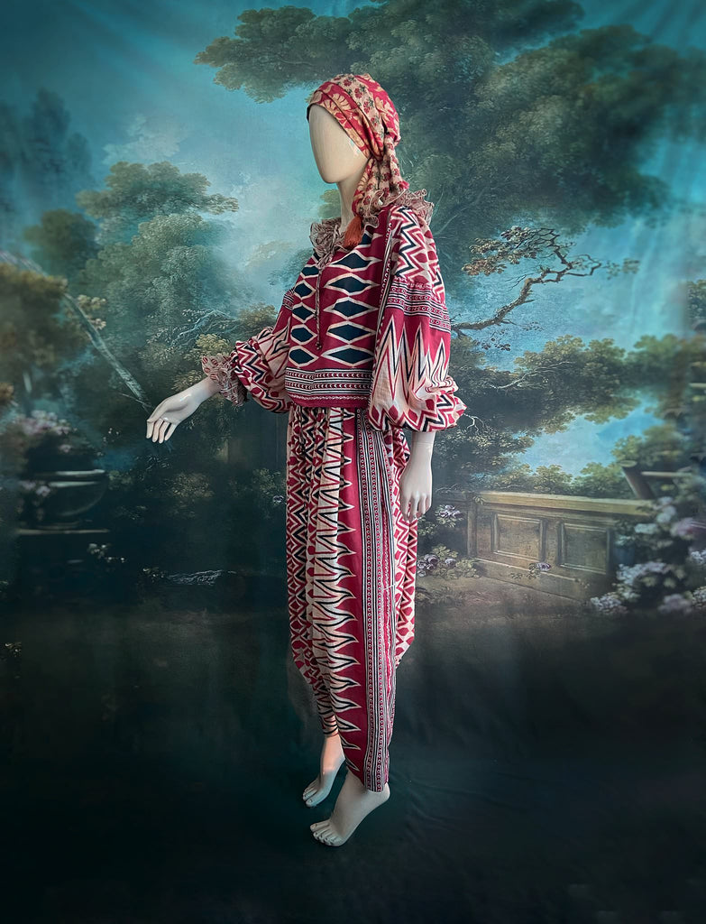 Red, black and ivory fine cotton Harlequin Corsair inspired beach pyjamas with full sleeved frill collar blouse and drawstring Ottoman harem pants. Bohemian styles created from  vintage and antique textiles by the Pavilion Parade studio