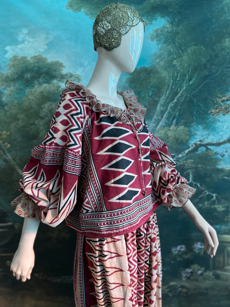 Red, black and ivory fine cotton Harlequin Corsair inspired beach pyjamas with full sleeved frill collar blouse and drawstring Ottoman harem pants. Bohemian styles created from  vintage and antique textiles by the Pavilion Parade studio