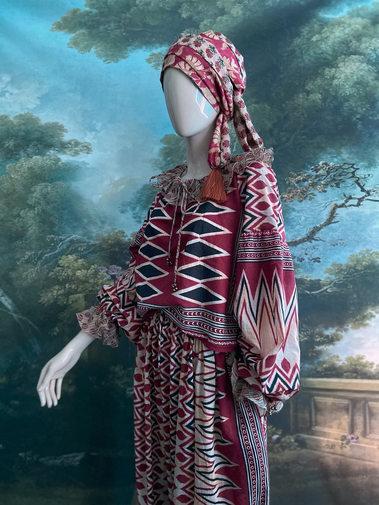 Red, black and ivory fine cotton Harlequin Corsair inspired beach pyjamas with full sleeved frill collar blouse and drawstring Ottoman harem pants. Bohemian styles created from  vintage and antique textiles by the Pavilion Parade studio