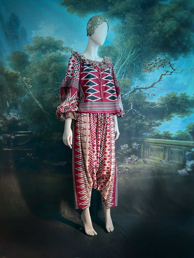 Red, black and ivory fine cotton Harlequin Corsair inspired beach pyjamas with full sleeved frill collar blouse and drawstring Ottoman harem pants. Bohemian styles created from  vintage and antique textiles by the Pavilion Parade studio