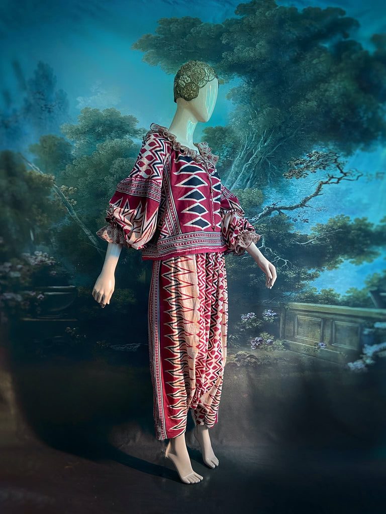 Red, black and ivory fine cotton Harlequin Corsair inspired beach pyjamas with full sleeved frill collar blouse and drawstring Ottoman harem pants. Bohemian styles created from  vintage and antique textiles by the Pavilion Parade studio