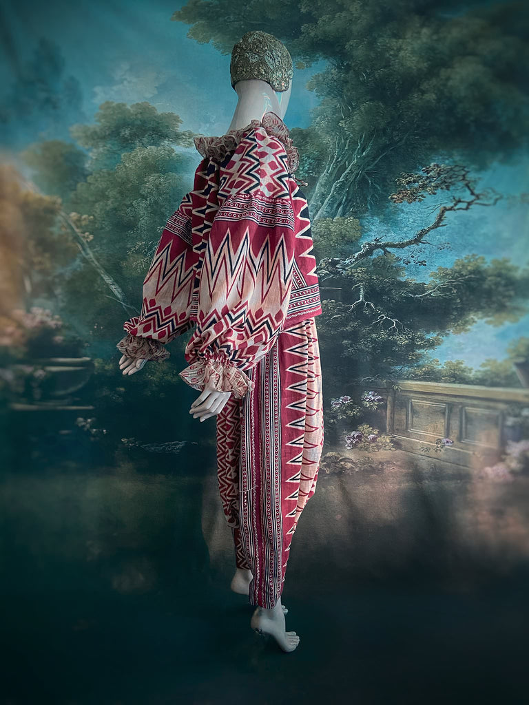 Red, black and ivory fine cotton Harlequin Corsair inspired beach pyjamas with full sleeved frill collar blouse and drawstring Ottoman harem pants. Bohemian styles created from  vintage and antique textiles by the Pavilion Parade studio