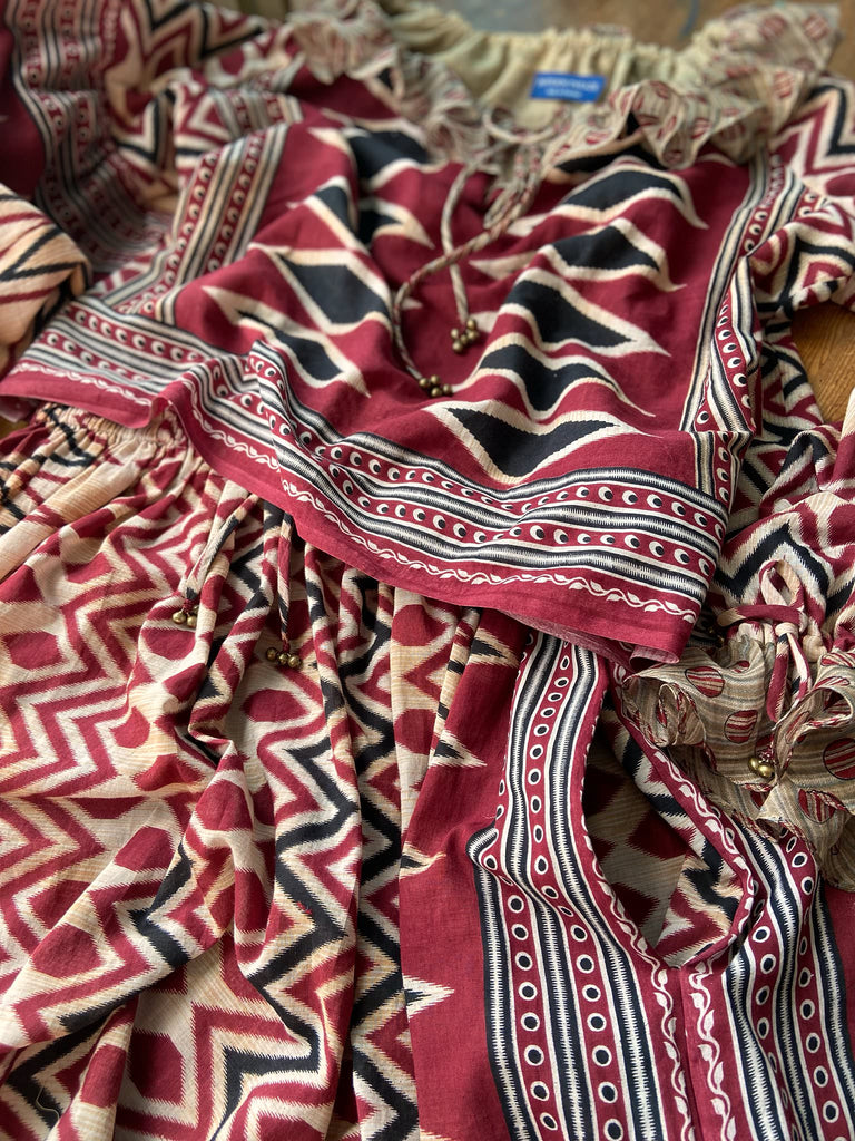 Red, black and ivory fine cotton Harlequin Corsair inspired beach pyjamas with full sleeved frill collar blouse and drawstring Ottoman harem pants. Bohemian styles created from  vintage and antique textiles by the Pavilion Parade studio