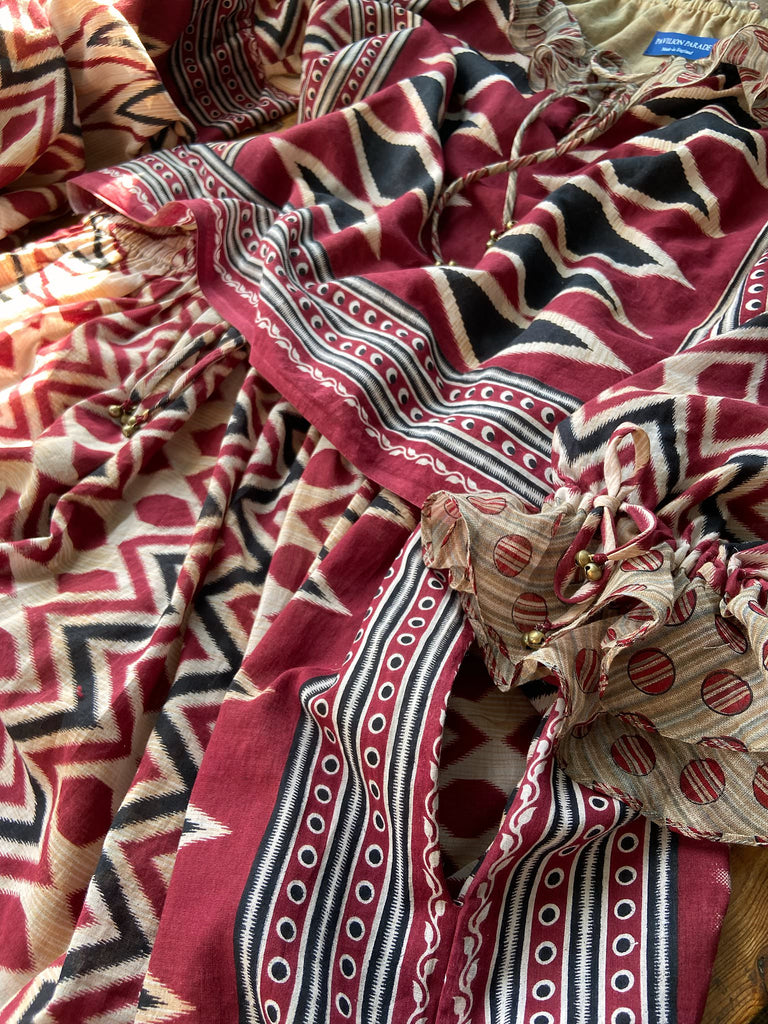 Red, black and ivory fine cotton Harlequin Corsair inspired beach pyjamas with full sleeved frill collar blouse and drawstring Ottoman harem pants. Bohemian styles created from  vintage and antique textiles by the Pavilion Parade studio