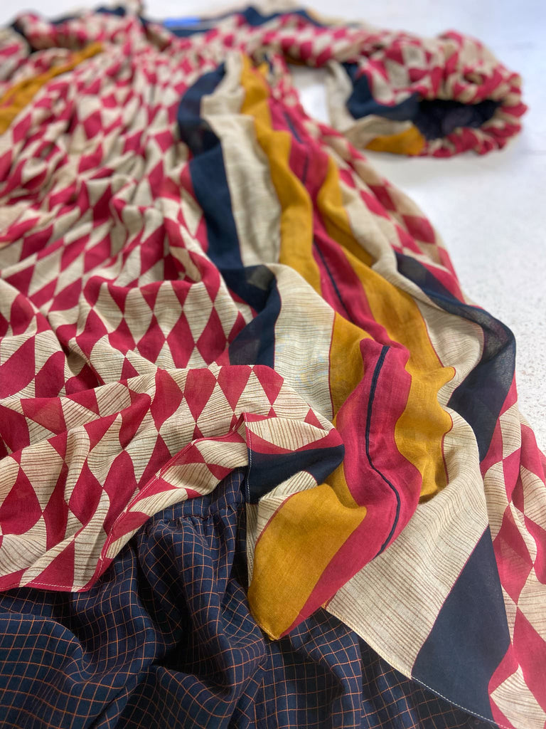 Harlequin red, yellow and black volume dress with long full sleeves and pockets. Bohemian style sustainably created from antique and vintage textiles by the Pavilion Parade studio