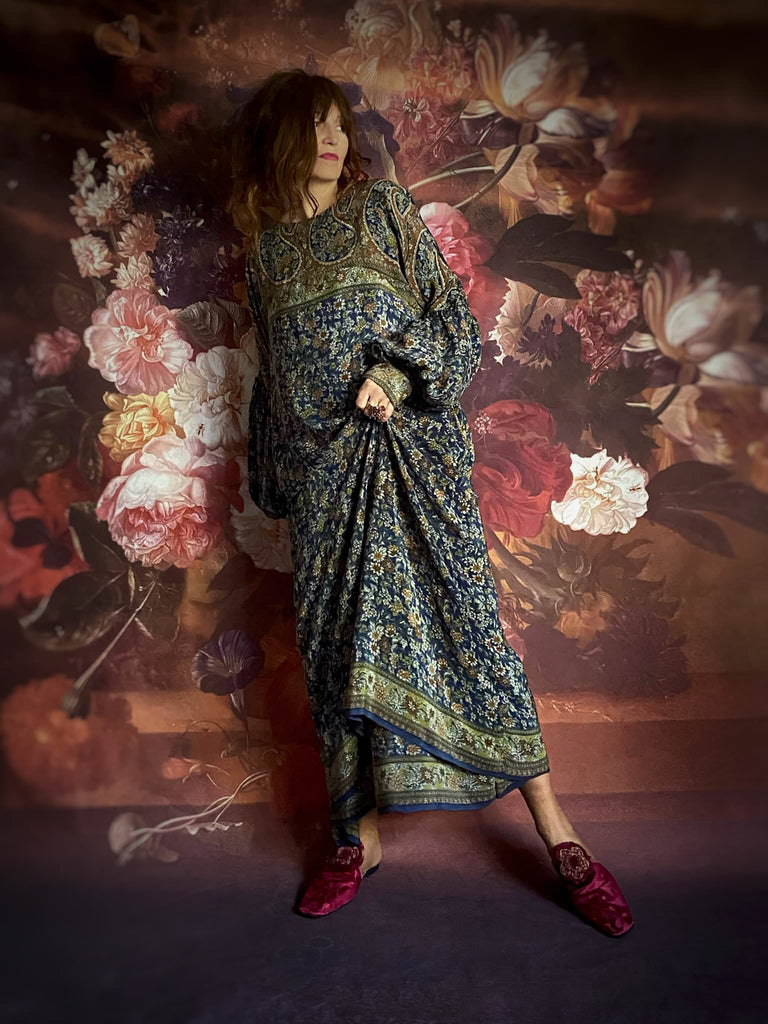 Indigo blue flower silk crepe dress with full sleeves gathered in to fitted cuffs.  Side pockets and shallow scoop neckline. Bohemian style created from vintage and antique textiles by the Pavilion Parade studio.
