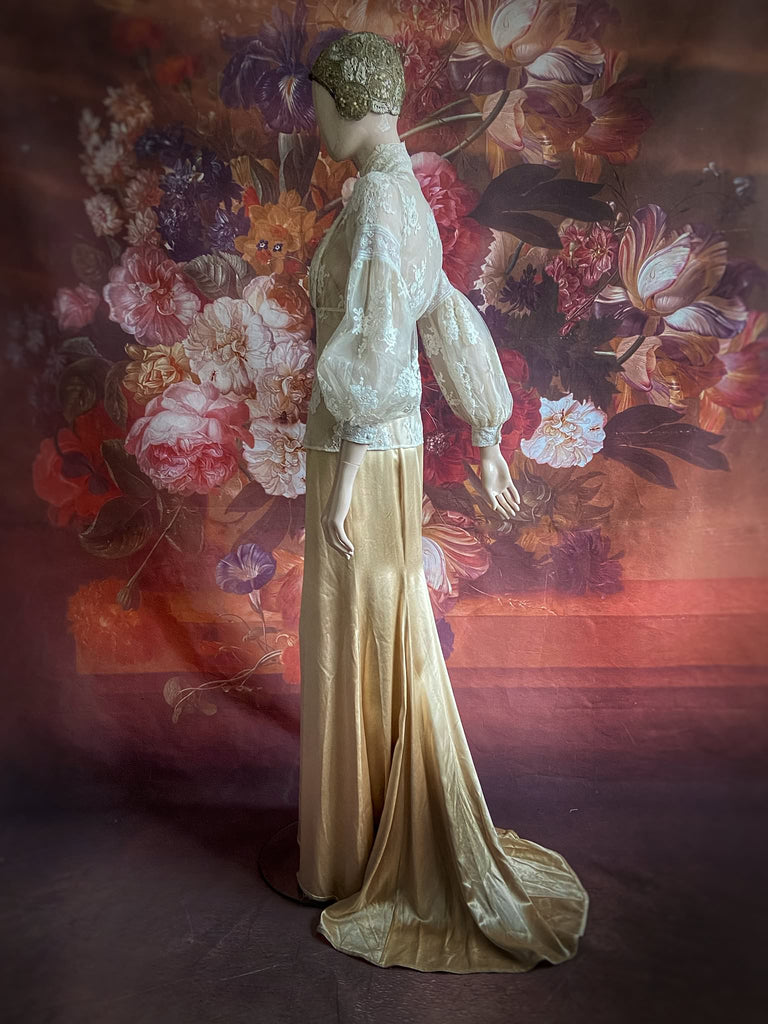 Ivory French lace and silk organza fitted romantic blouse. Antique lace elements at high fitted collar and cuffs. Full bishop sleeves and pleated bodice front. A flight of fancy from the Pavilion Parade studio. 