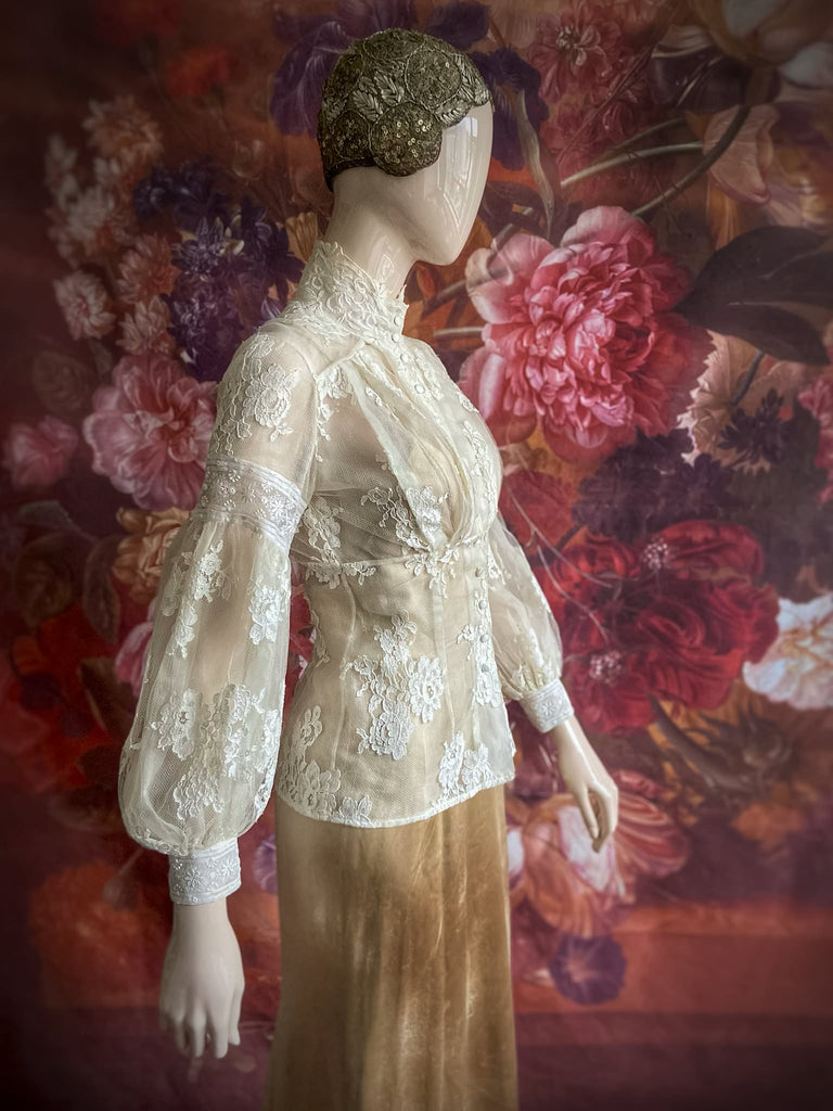 Ivory French lace and silk organza fitted romantic blouse. Antique lace elements at high fitted collar and cuffs. Full bishop sleeves and pleated bodice front. A flight of fancy from the Pavilion Parade studio. 