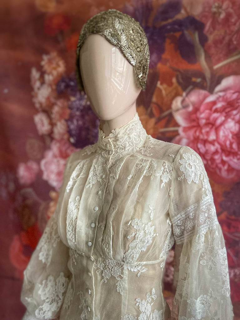 Ivory French lace and silk organza fitted romantic blouse. Antique lace elements at high fitted collar and cuffs. Full bishop sleeves and pleated bodice front. A flight of fancy from the Pavilion Parade studio. 