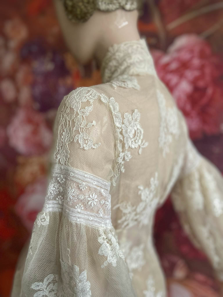 Ivory French lace and silk organza fitted romantic blouse. Antique lace elements at high fitted collar and cuffs. Full bishop sleeves and pleated bodice front. A flight of fancy from the Pavilion Parade studio. 