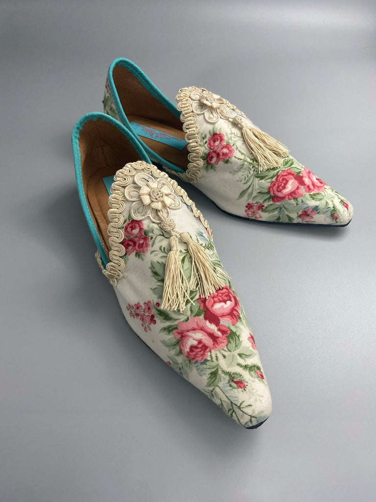 Rosebud toile pointed toe shoes with antique silk tassel appliqué rosettes and passementerie braid. Bohemian style created from antique and vintage textiles by Pavilion Parade.