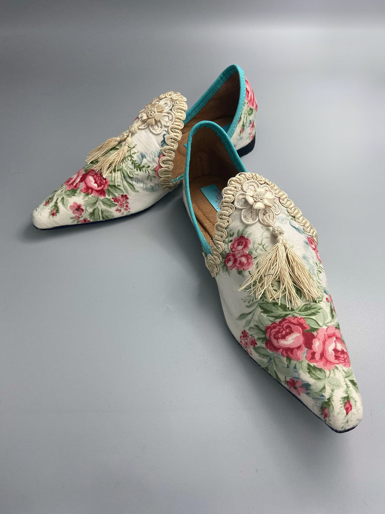 Rosebud toile pointed toe shoes with antique silk tassel appliqué rosettes and passementerie braid. Bohemian style created from antique and vintage textiles by Pavilion Parade.