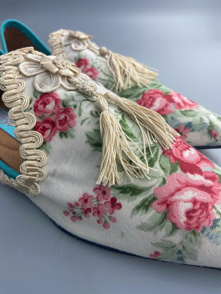 Rosebud toile pointed toe shoes with antique silk tassel appliqué rosettes and passementerie braid. Bohemian style created from antique and vintage textiles by Pavilion Parade.