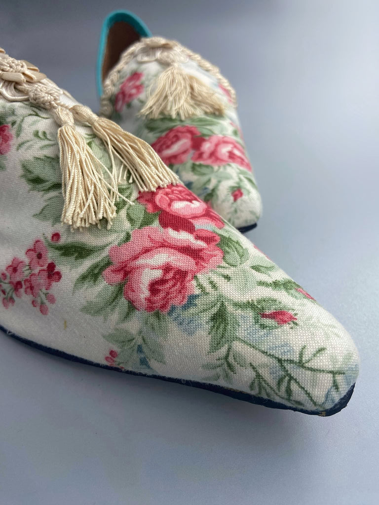 Rosebud toile pointed toe shoes with antique silk tassel appliqué rosettes and passementerie braid. Bohemian style created from antique and vintage textiles by Pavilion Parade.