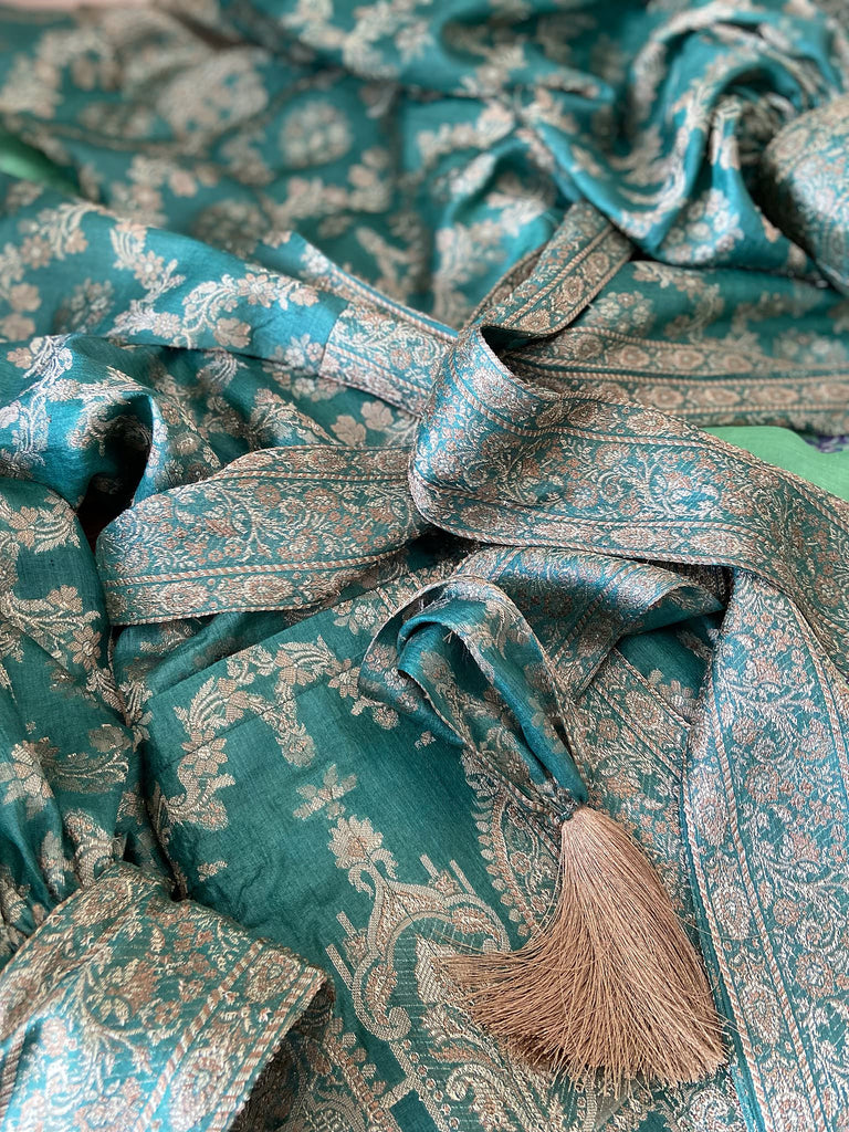 Jade green lightweight silk wrapper robe with full sleeves, large patch pockets and tassel sash. Bohemian style sustainably created from antique and vintage textiles by the Pavilion Parade studio.